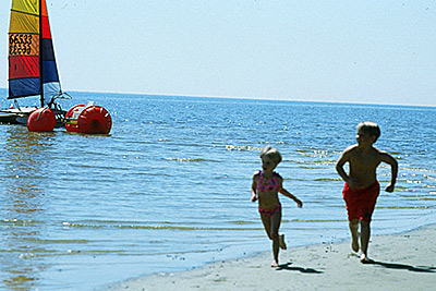 Biloxi children running on beach
