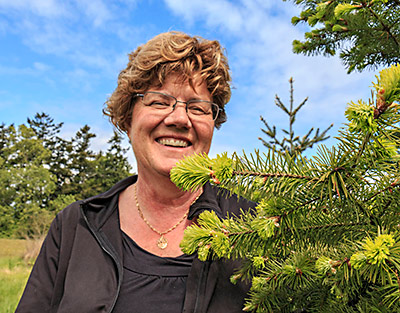 Laura Waters with Douglas fir tree