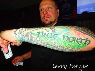 Kootenay Lake bartender with tatoo
