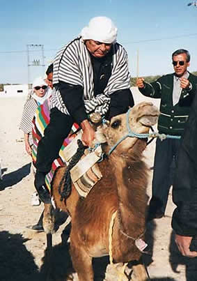 Tunisia, Douz, author Habeeb Salloum begins camel ride