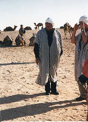 Tunisia, Douz, Habeeb Salloum prepping for camel ride