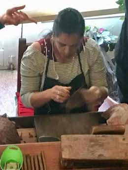 Cigar-maker in Cuban store