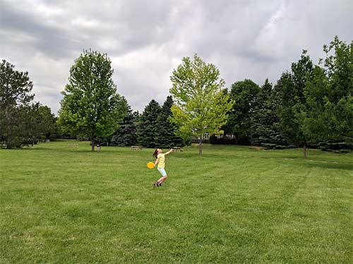 Erysse Elliott tosses frisbee in Fort Collins, Colo.