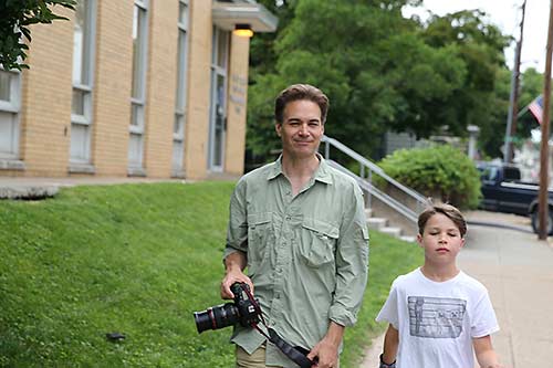 Author with old camera and son
