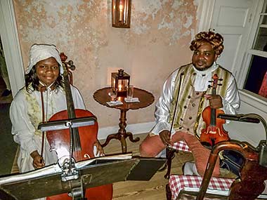 Barbados servants play chamber music during dinner