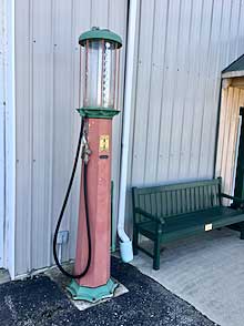 A vintage gas pump on display at the Model T Museum