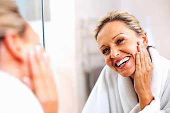 Woman applying makeup