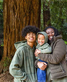 Family in front of huge tree