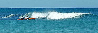 Kayak surfing on Maui
