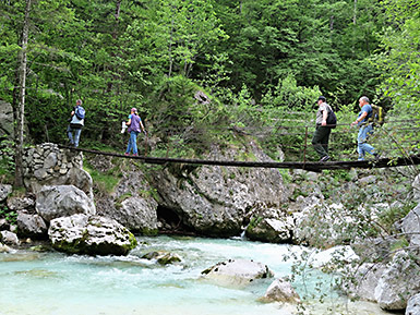 Wooden bridge crosses the Soca River