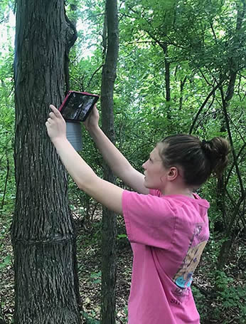 Girl with tablet outdoors