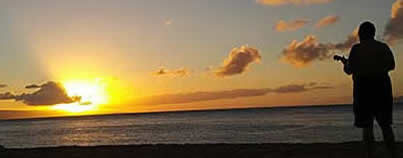 Ukelele player at sunset