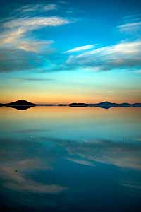 Bolivia, dawn with water mirage on salt flats